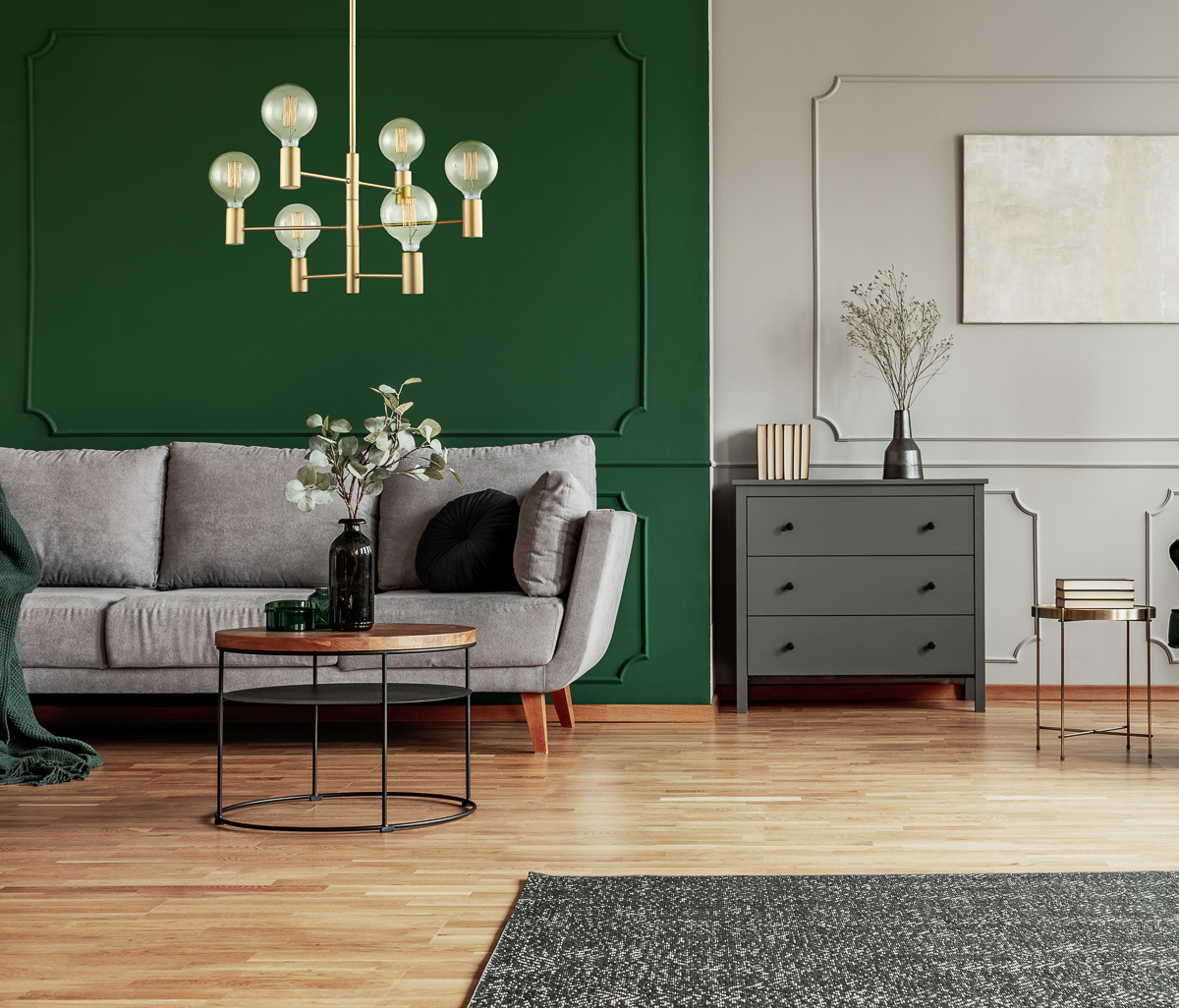 Emerald green wing back chair with pillow in grey living room interior with wooden commode MDM3339 6 GD aranz
